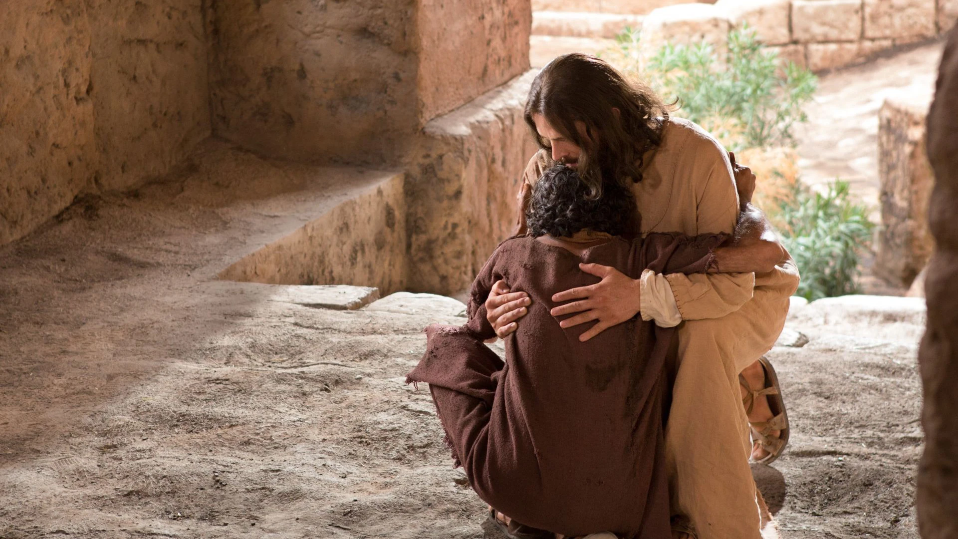 Jesus is hugging a blind man that he healed on Sabbath as told in John 9